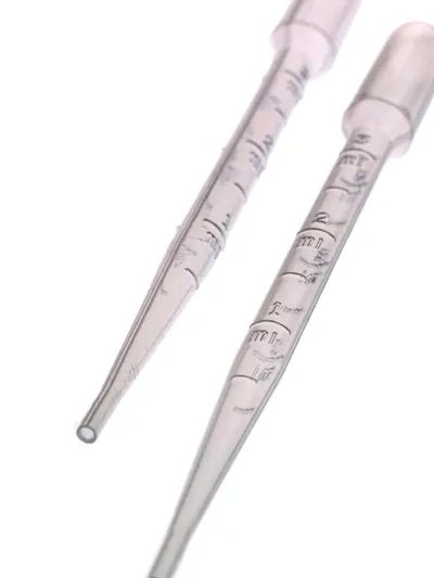 Close-up of two transparent graduated pipettes used for precise liquid measurement.