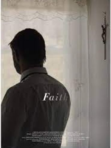 Man standing in front of a sheer curtain with a cross on the wall.