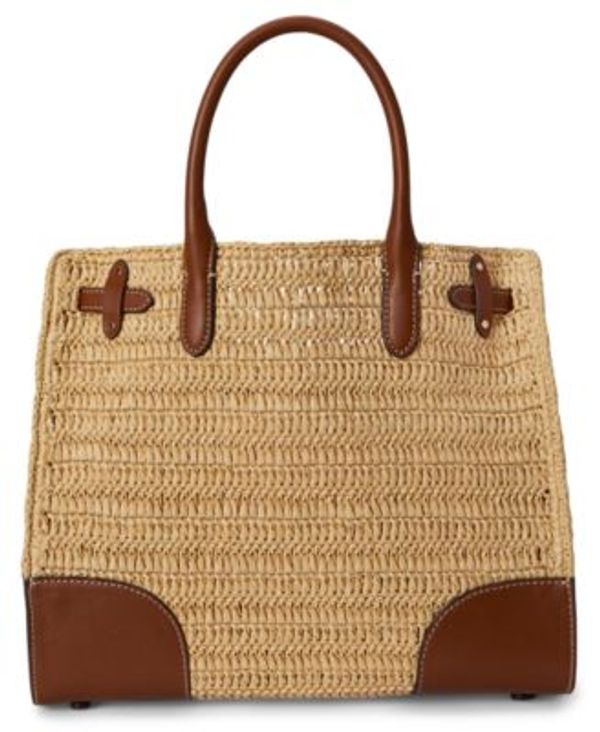 Woven straw handbag with brown leather handles and accents.