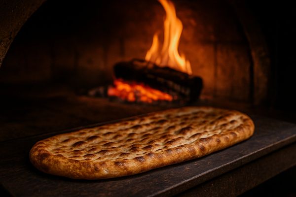 A Persian pizza being baked