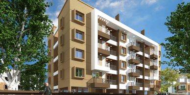 Modern apartment building with balconies and parked cars on a sunny day.