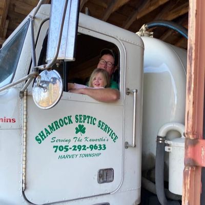 Owner and child in work truck