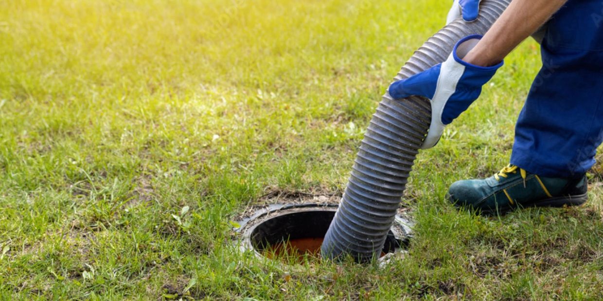 Person pumping a septic