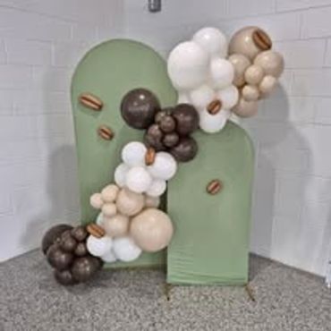 Decorative balloon arrangement with coffee bean accents.
