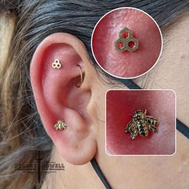 Honeycomb and bee piercings made from gold