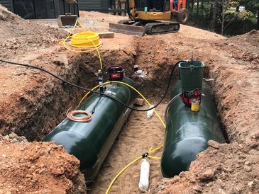 2 1000 gallon underground propane tanks being manifolded and installed with polyethylene yard line. 
