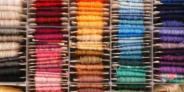 Colorful embroidery threads organized in compartments.