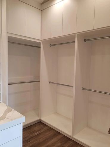 White closet with double hanging rods