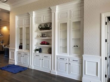 White built-in display cabinets with glass doors