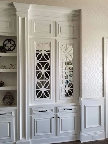 White display cabinet with decorative glass doors