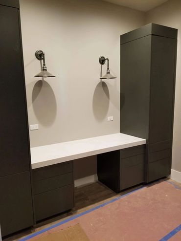 Dark double vanity with tall linen cabinet