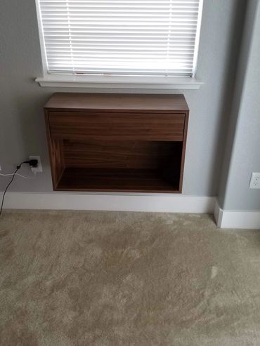 Floating walnut wall cabinet