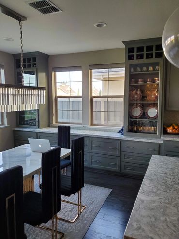 Kitchen and dining area with gray cabinets
