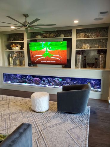 White entertainment wall with built-in aquarium