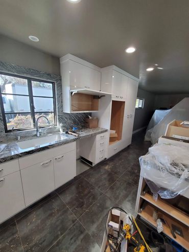 White kitchen cabinets during installation