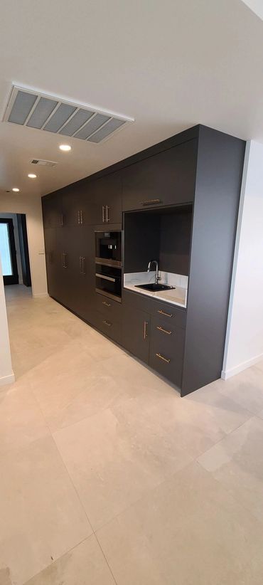 Dark built-in wall unit in hallway