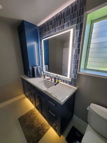 Navy vanity with lighted mirror