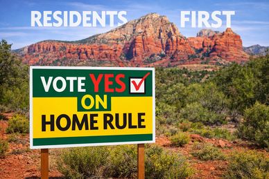 Sign urging residents to vote yes on home rule against a scenic mountain backdrop.