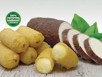 Golden fried cassava snacks with fresh cassava and green leaves.