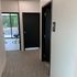 A picture of the hallway at bohn dental showcasing the doorway to the patient restroom and clinic.
