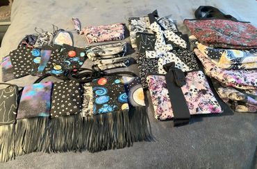 Assortment of trinket bags, book / tablet sleeves, pouches and small accessories. 