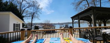 Relaxing by the water on a sunny day with clear skies.