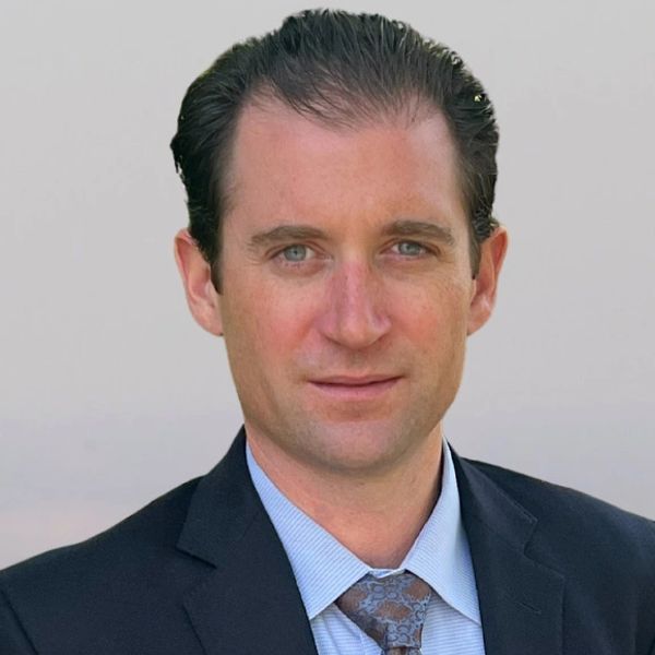 Professional man in a suit with a confident expression.