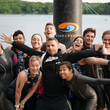 triathletes pre-race in wetsuits  