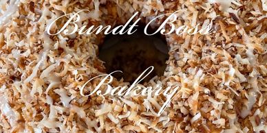 Close-up of a coconut-topped cake with white icing from Bundt Base Bakery.