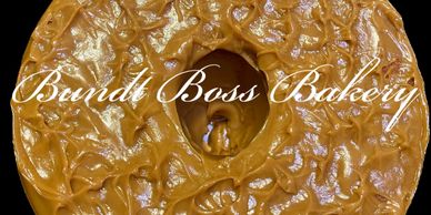 Close-up of a caramel-glazed bundt cake with 'Bundle Boss Bakery' text overlay.