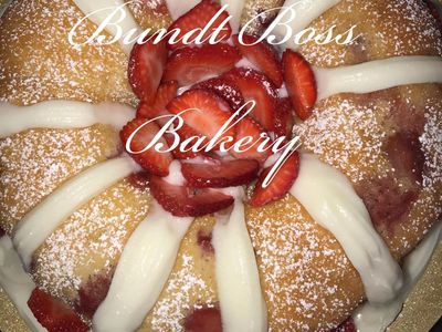 Bundt cake with cream and fresh strawberries from Bundt Boss Bakery.
