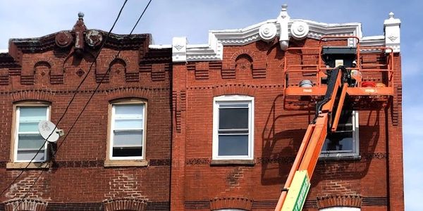 701 N 40th. Pictured repointing of original exterior brick. 