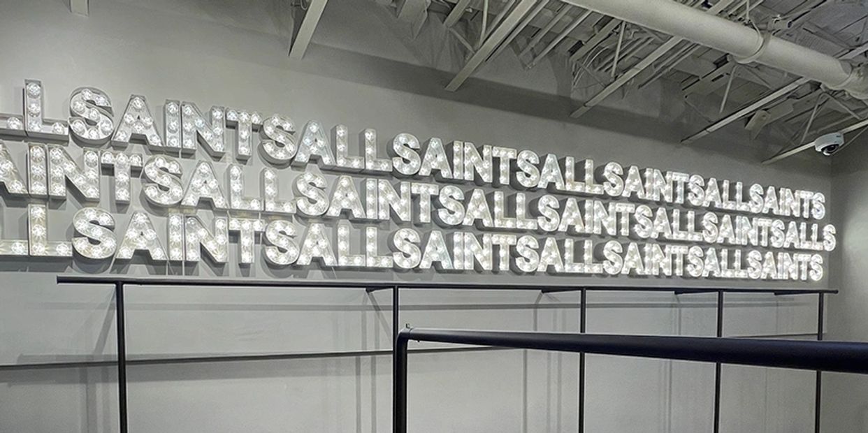 Outdoor business signage with branded logo for boutique in Inglewood