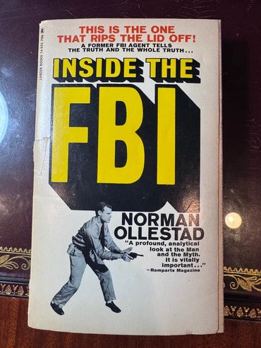 Vintage book cover titled 'Inside the FBI' by Norman Ollestad with a man holding a gun.