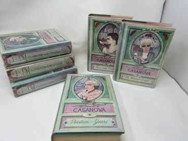 Set of illustrated hardcover books titled 'The Memoirs of Casanova' with pastel covers.