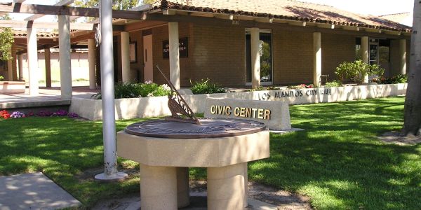 A photo of the current Los Alamitos Civic Center with a view of the sundial and Civic Center sign. 
