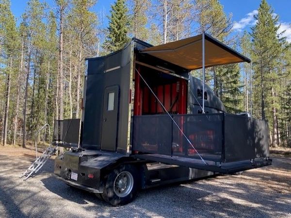 HDToy Box RV Hauler with both patio decks setup with safety railings and awning