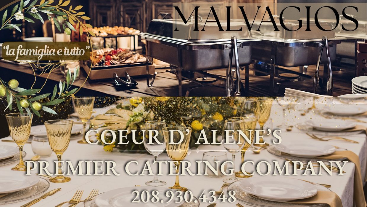 Elegant catering setup by Malvagios with fine dining table and buffet trays.