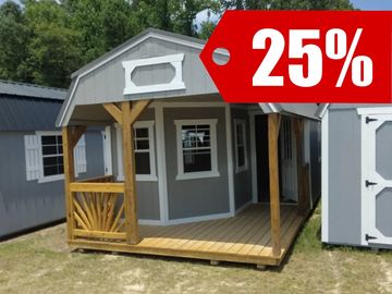 A gray wooden shed with a porch and 20% discount sign.