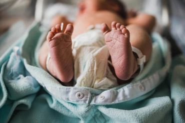 Close-up of a newborn baby's feet.