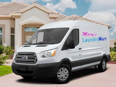 Van picking up linens from Airbnb for Mary’s Laundromart.