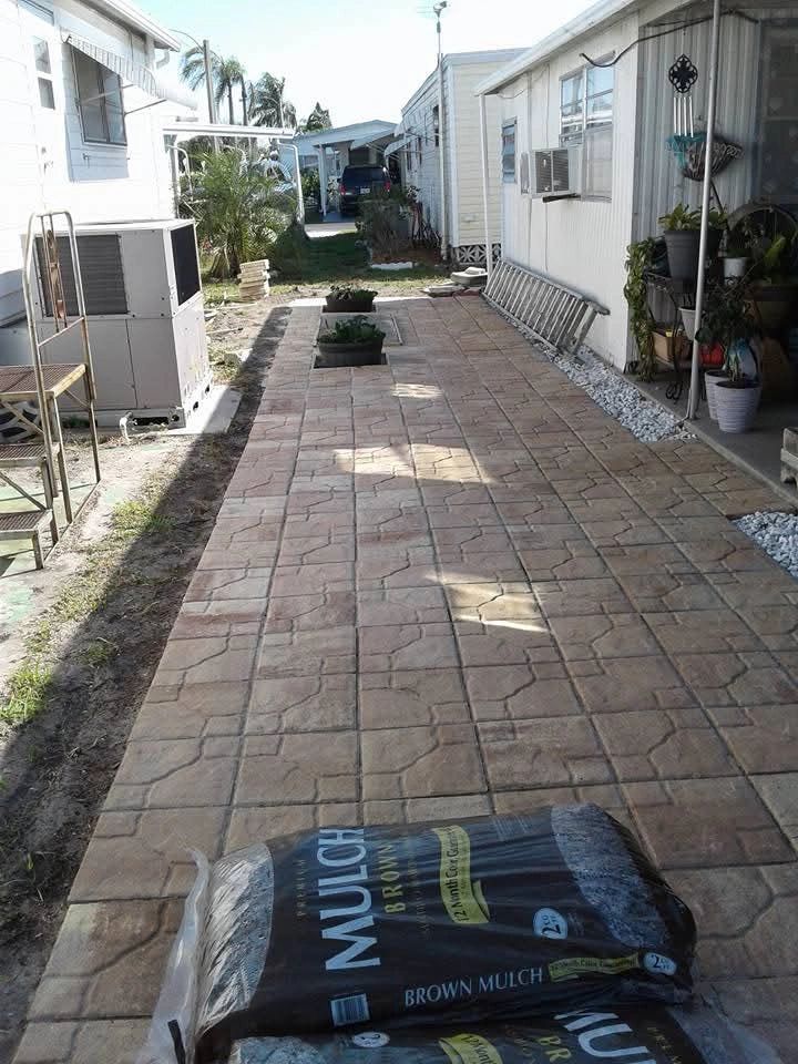 A finished paver walkway between homes