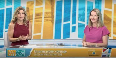 Two women discuss ensuring proper news coverage on a live broadcast.