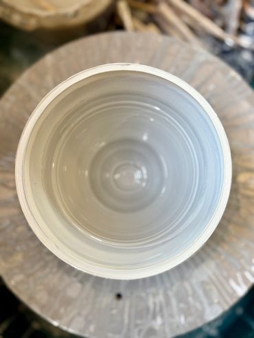 Top view of a pottery wheel with clay.