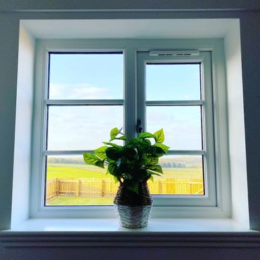 a beautiful bedroom with comfortable bed and luxurious bedding, with views to the sea