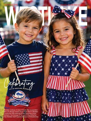 Two children smiling, holding American flags, dressed in patriotic outfits.