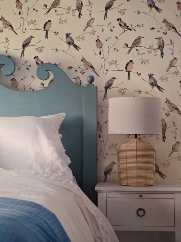 Photo of bedroom featuring custom wallpaper