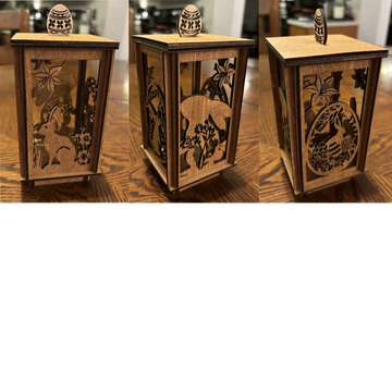 Wooden lantern with intricate animal and nature designs on each side.