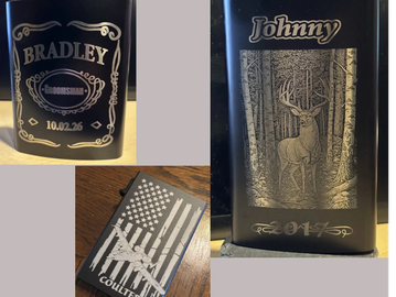 Three personalized metal flasks with engraved names and designs.