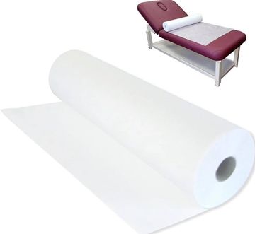 Medical exam table paper roll mounted on exam table with fresh sheet pulled across surface. 